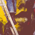 People painting on the wall on the stairs