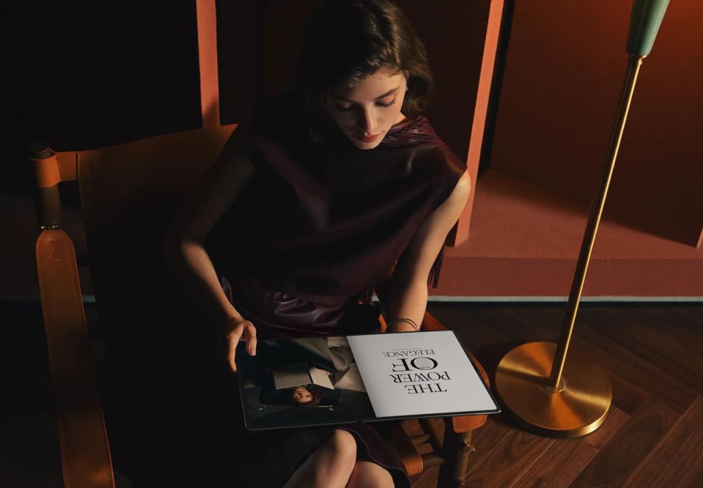 Woman reading Huawei MateBook