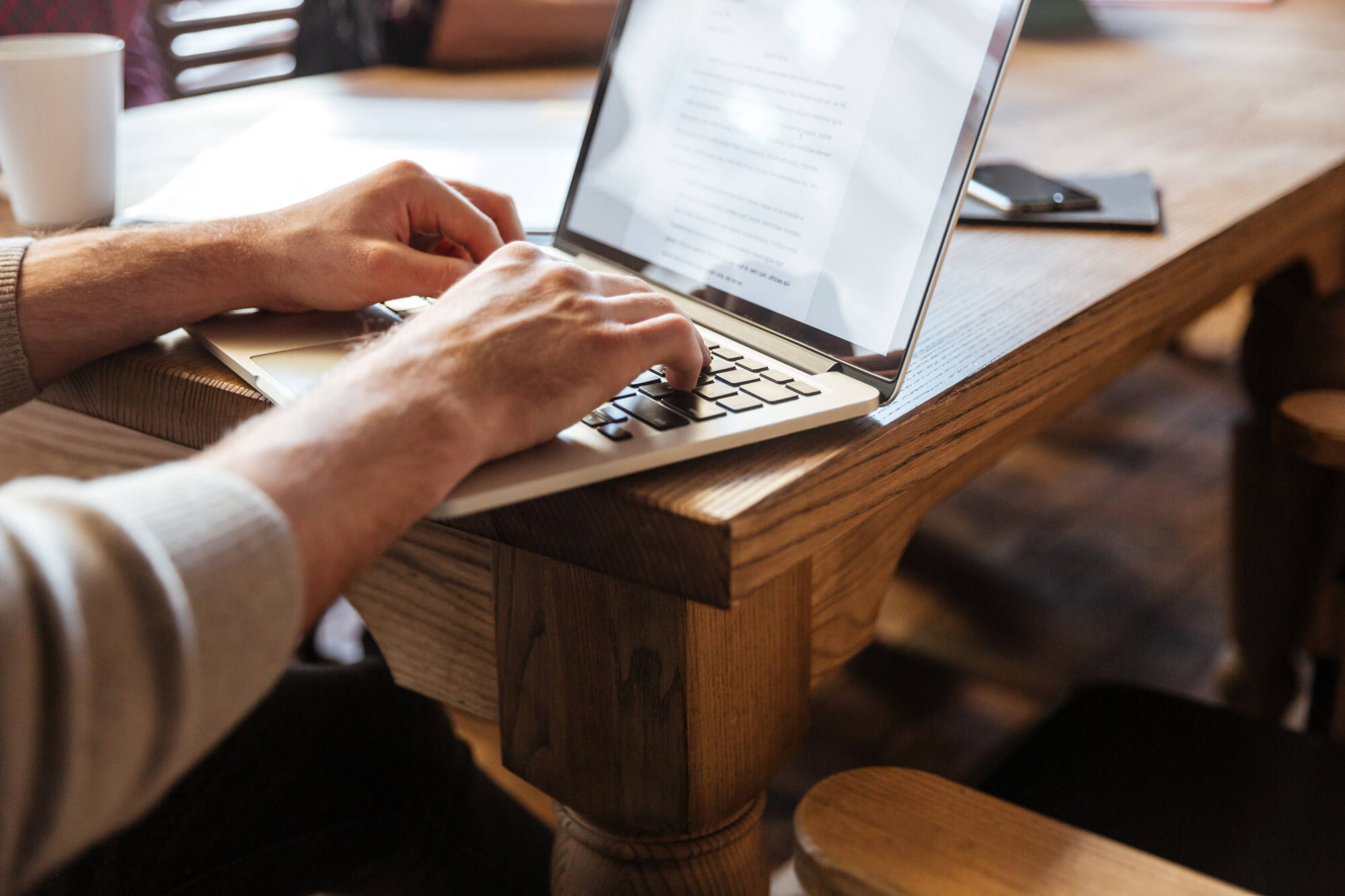 Man writing on laptop