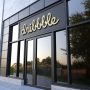 A Dribbble logo on building