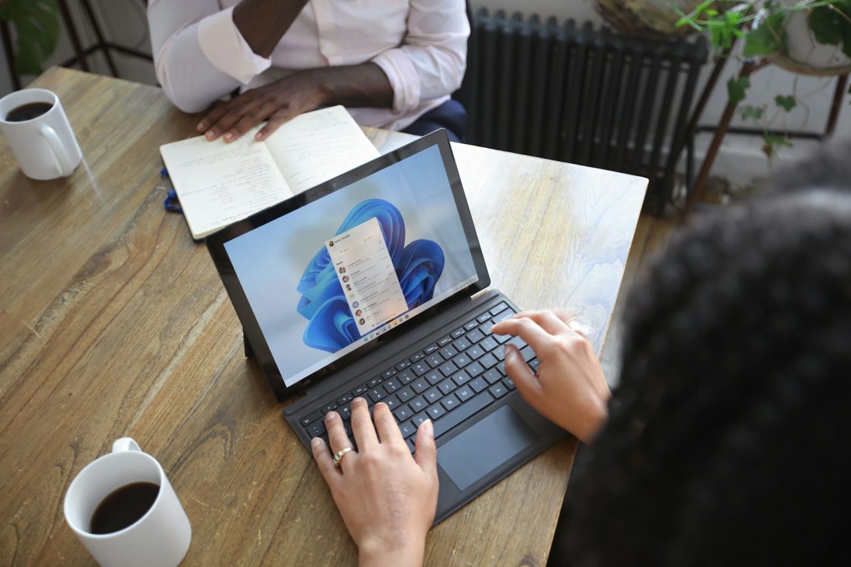 Woman using MacBook and Windows 10