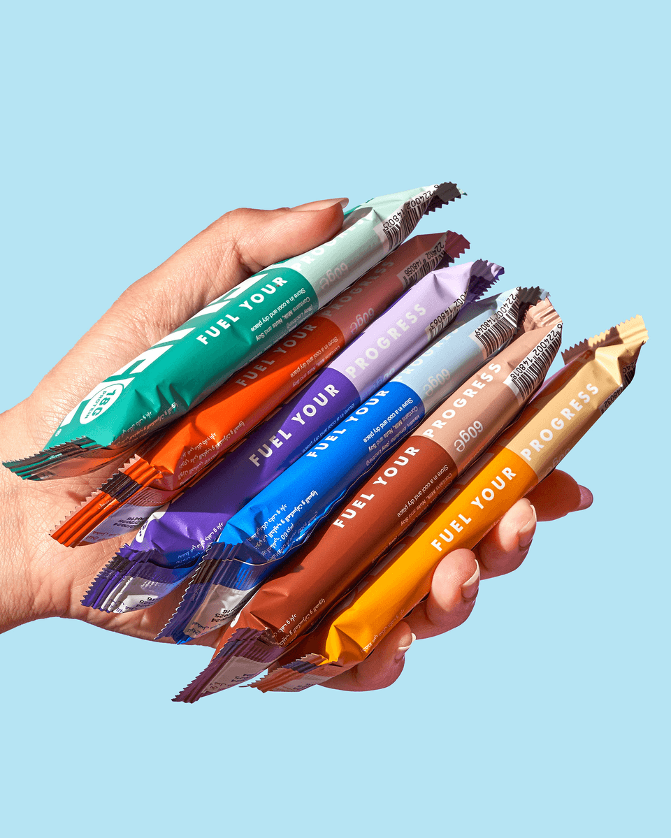 A hand holding Refuel protein bars