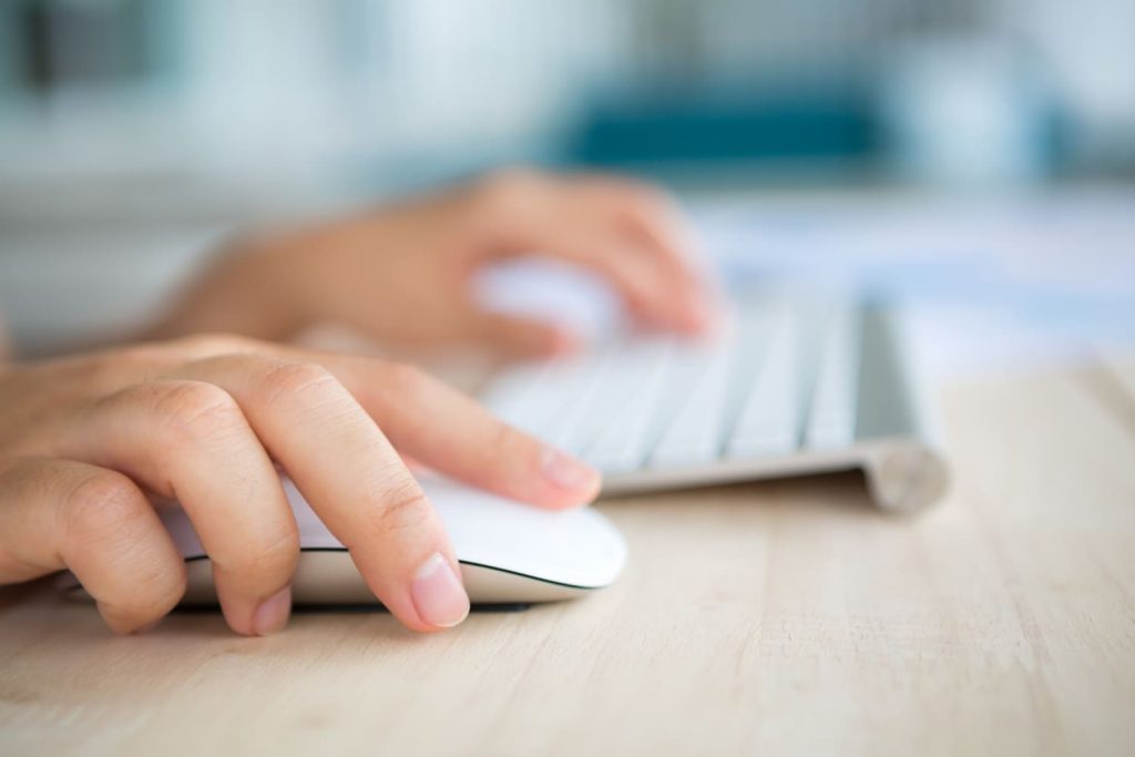 A person using keyboard and mouse