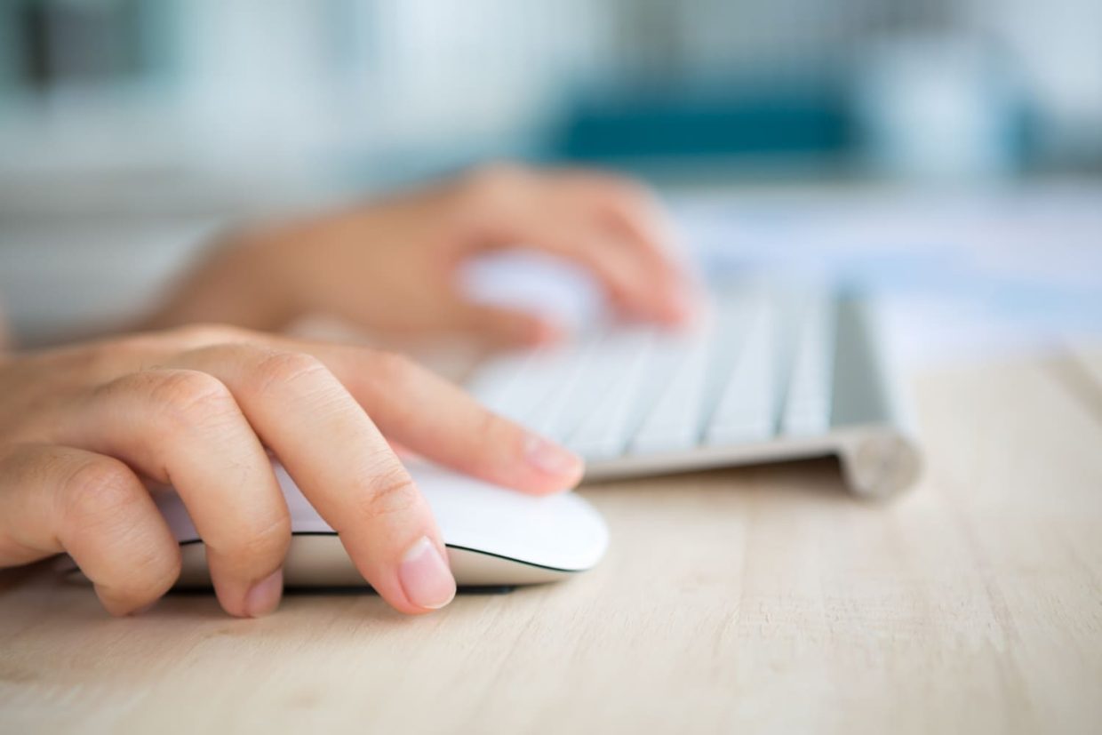 A person using keyboard and mouse