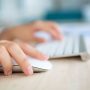 A person using keyboard and mouse