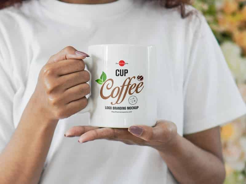 A girl holding coffee cup mockup