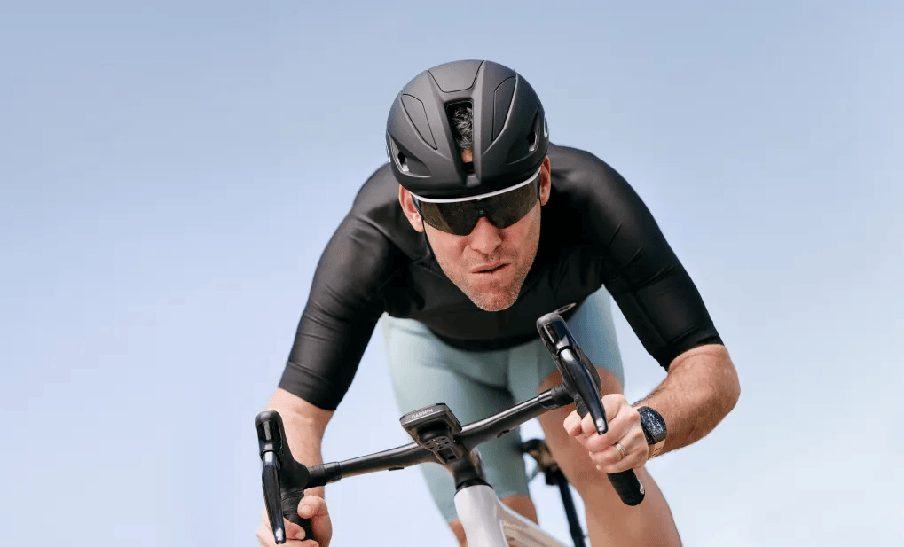 The athlete with bike, helmet and smart glasses