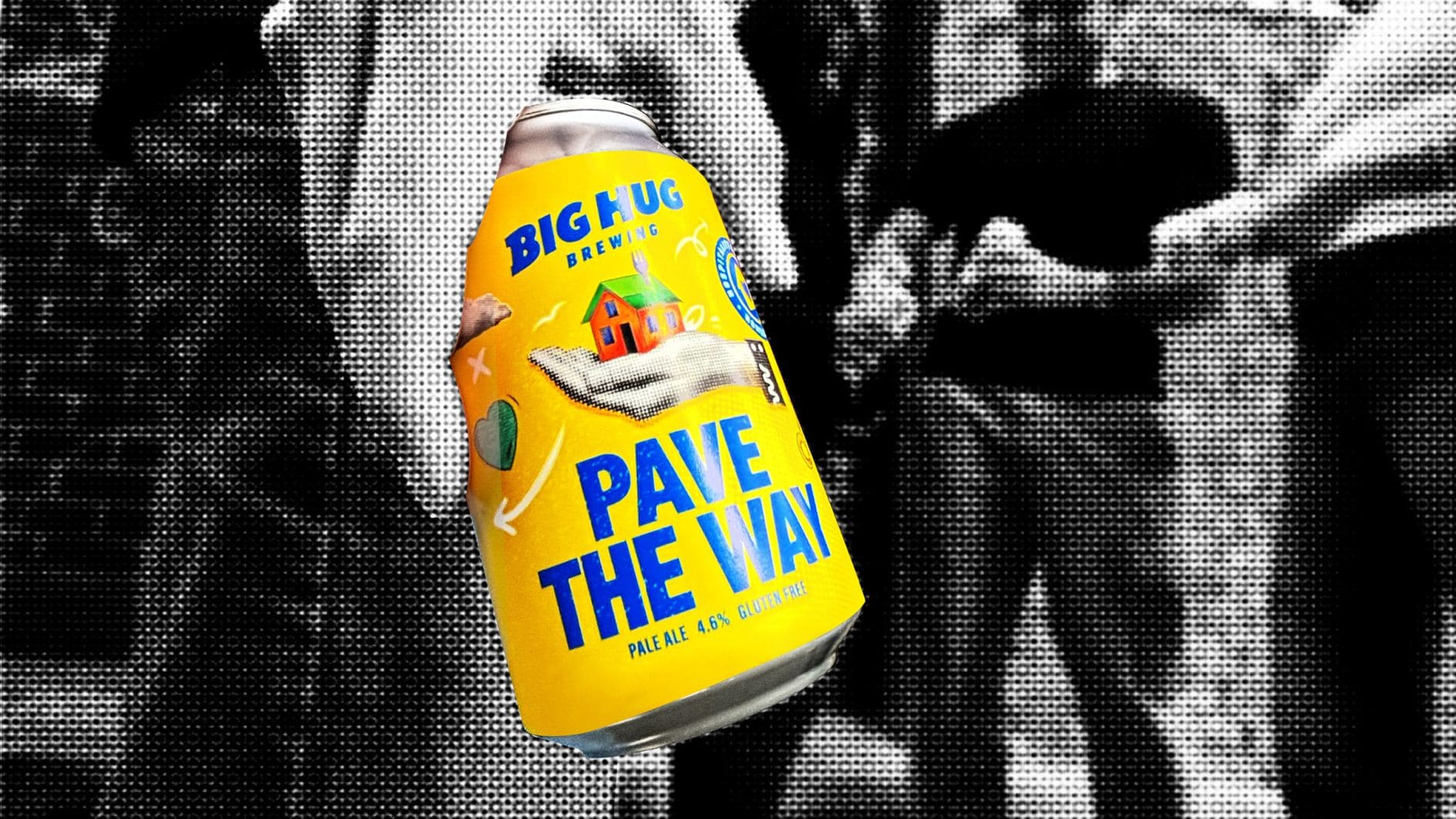 Hand holding Big Hug beer can