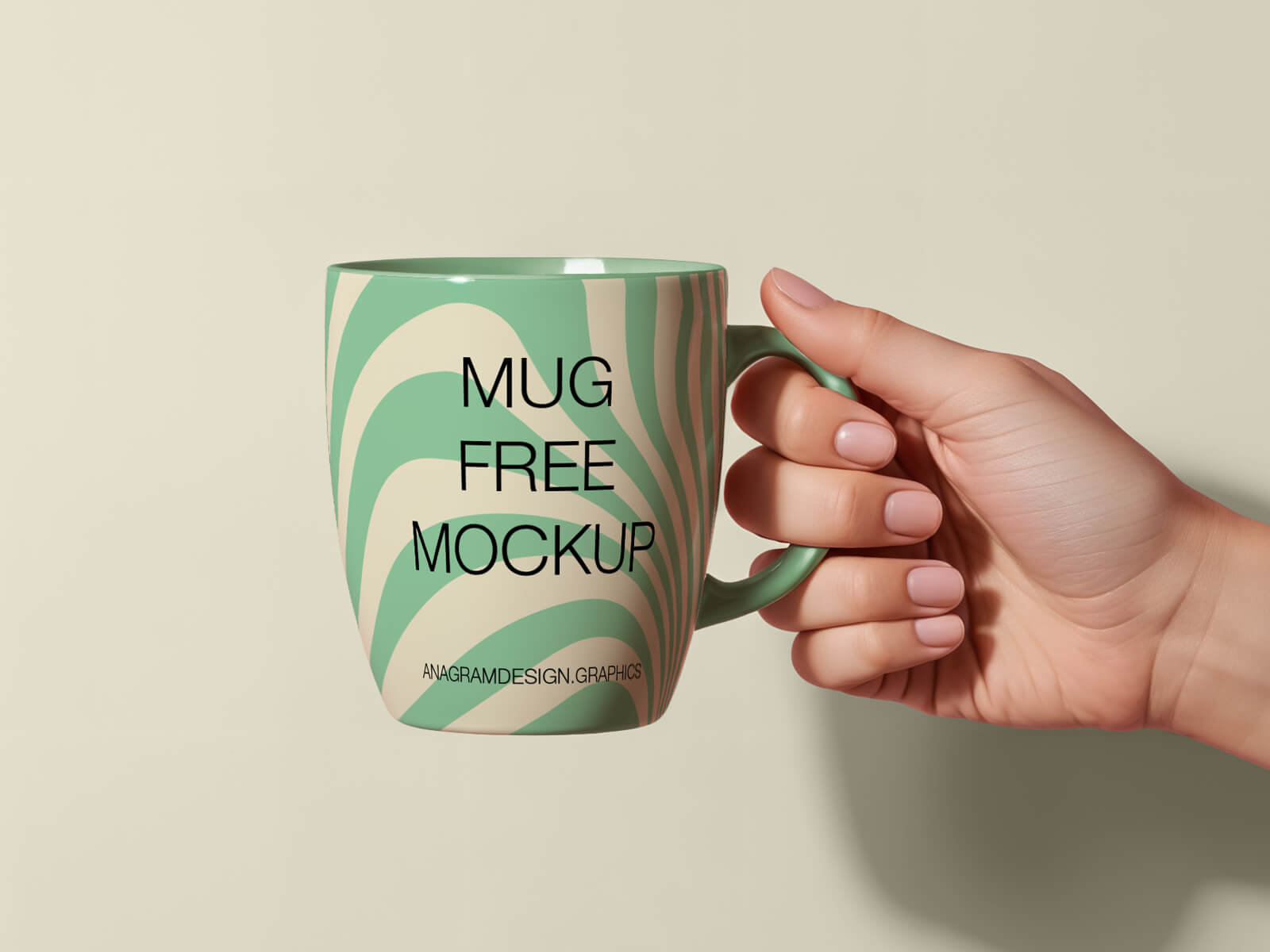 A free mug in hand mockup