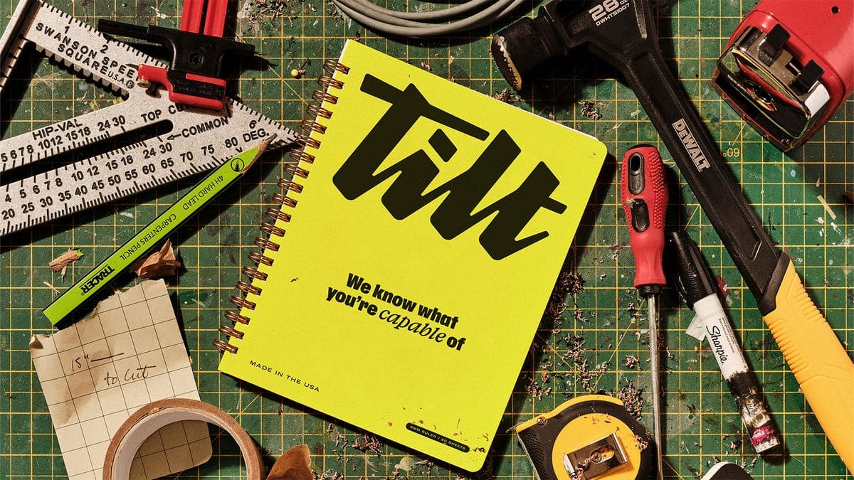 A Tilt logo design near by working equipment