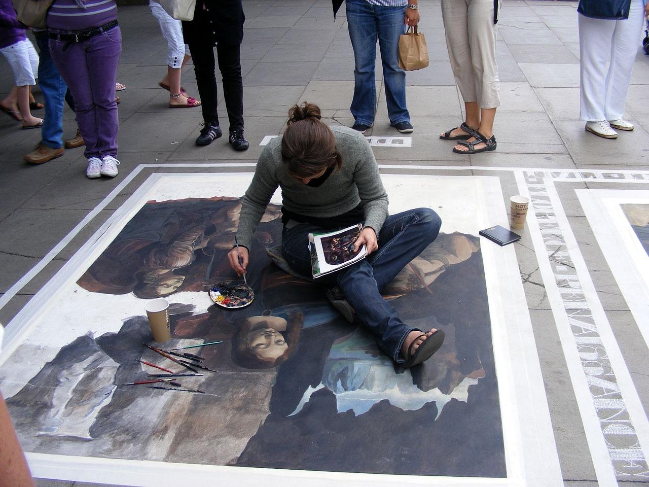 A man doing street art