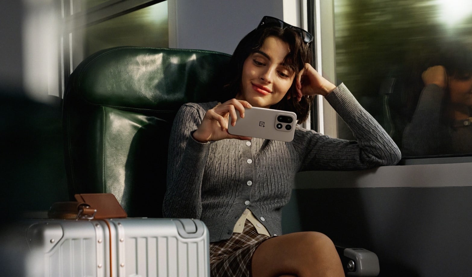 Women using OnePlus 15R smartphone