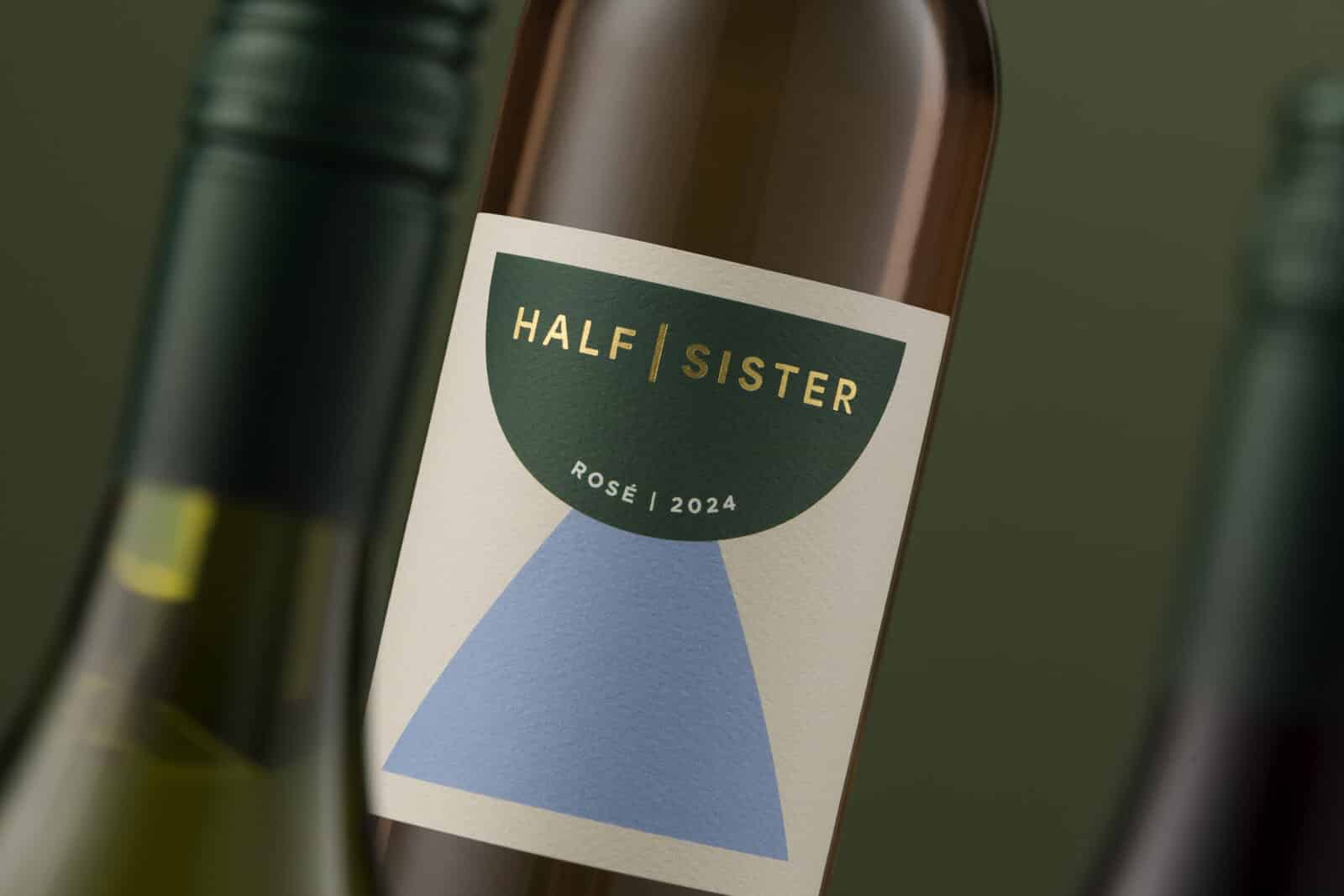 A Half Sister green and brown bottles