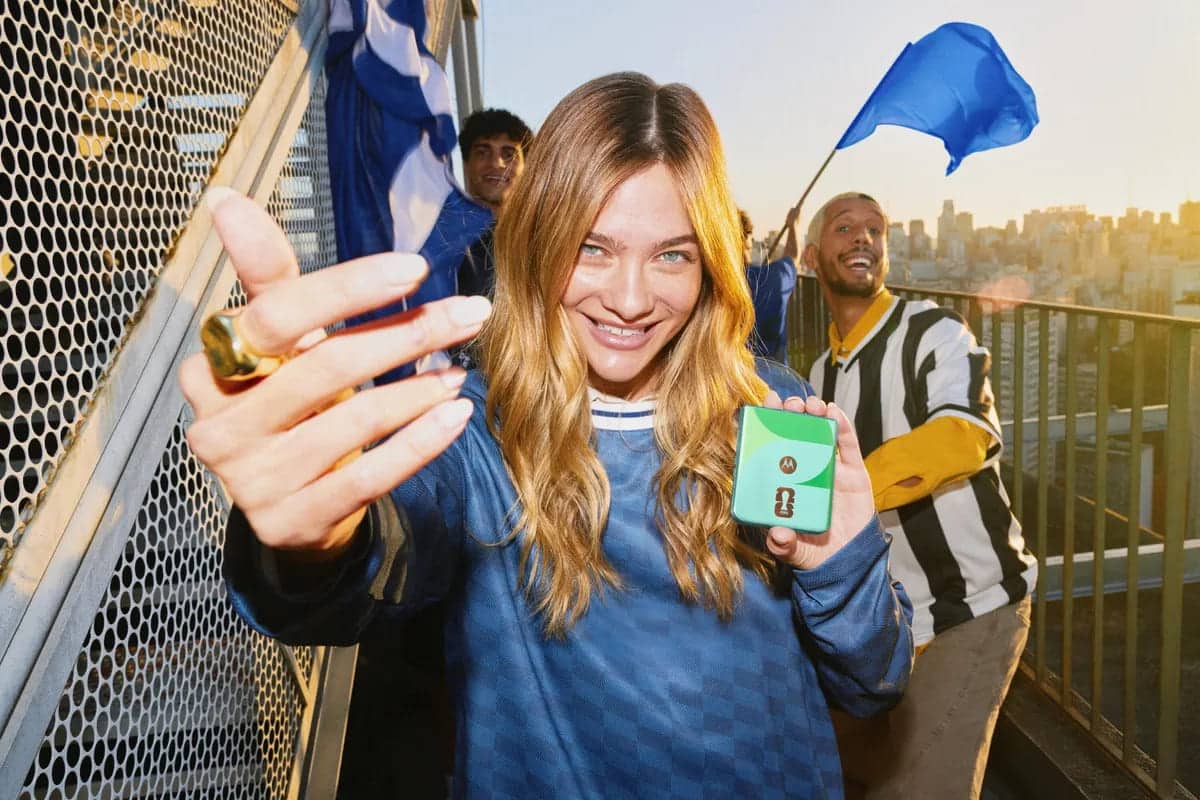 People celebration sport with Motorola's Razr phone in hand