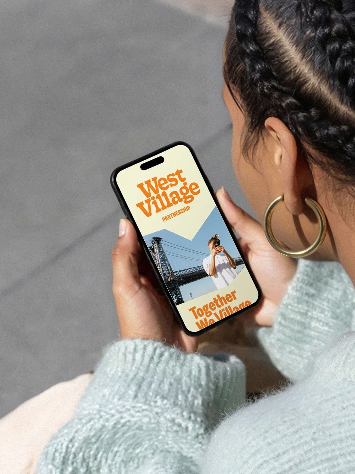 A girl searches the West Village in phone