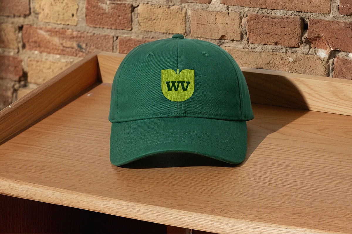 West Village logo on hat