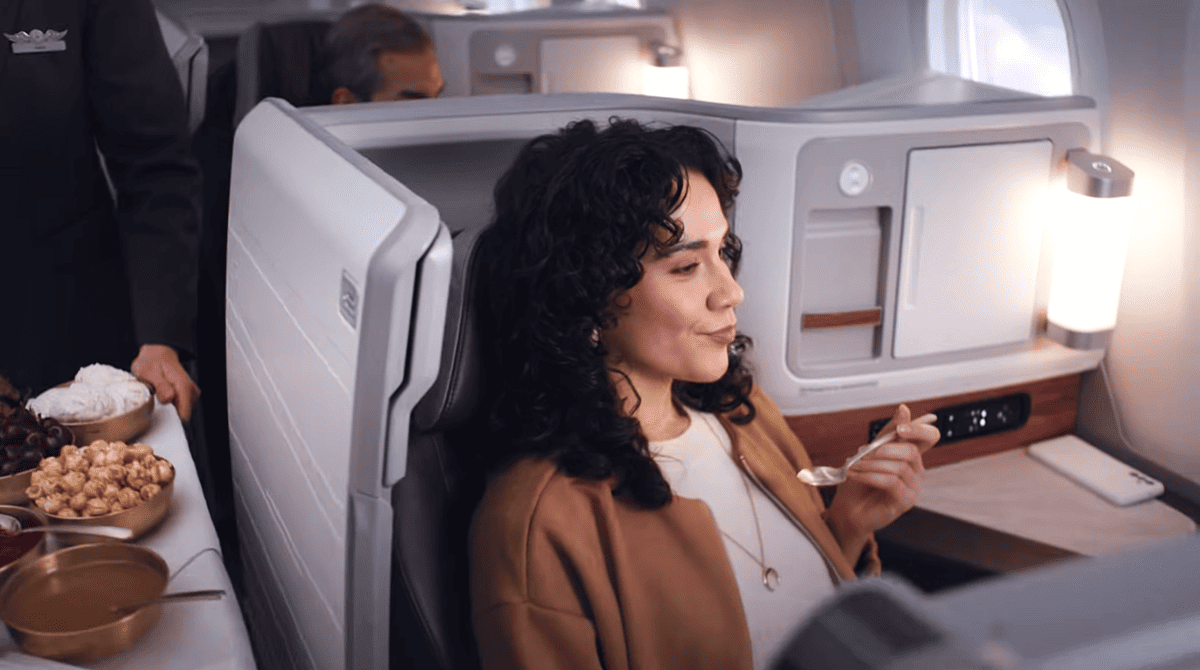 A woman eating desert in Alaska Airlines